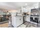 Modern kitchen with white cabinetry open to the living room and stainless appliances at 3062 Tarpon Dr # 201, Las Vegas, NV 89120