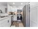 Updated kitchen with stainless steel appliances and white cabinets at 3062 Tarpon Dr # 201, Las Vegas, NV 89120