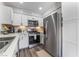 Well-lit kitchen with stainless steel appliances, white cabinets, and modern countertops at 3062 Tarpon Dr # 201, Las Vegas, NV 89120