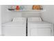 Laundry room with side-by-side washer and dryer, and storage shelf at 3062 Tarpon Dr # 201, Las Vegas, NV 89120