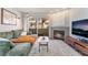 Comfortable living room with fireplace, couch, and sliding doors to balcony at 3062 Tarpon Dr # 201, Las Vegas, NV 89120