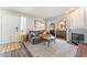 Bright living room featuring sliding door access to a small balcony and fireplace at 3062 Tarpon Dr # 201, Las Vegas, NV 89120