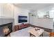 Inviting living room showcasing cozy fireplace open to adjacent kitchen at 3062 Tarpon Dr # 201, Las Vegas, NV 89120