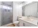 Bright bathroom with a glass enclosed shower, white vanity, and tile floors at 4411 Elk Point Cir, Las Vegas, NV 89147