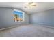 Bedroom features vaulted ceilings and a large window with a view at 4411 Elk Point Cir, Las Vegas, NV 89147
