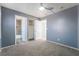 Bedroom featuring neutral colored walls, carpeting, and bathroom access at 4411 Elk Point Cir, Las Vegas, NV 89147