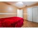 Bedroom with wood floors, white trim, and a closet with sliding doors at 4411 Elk Point Cir, Las Vegas, NV 89147
