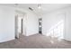 Bedroom with neutral carpeting and access to ensuite bathroom at 4411 Elk Point Cir, Las Vegas, NV 89147