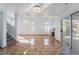 Bright living room featuring tile floors, a fireplace, and sliding glass doors to the backyard at 4411 Elk Point Cir, Las Vegas, NV 89147