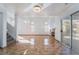 Bright living room featuring tile floors, a fireplace, and sliding glass doors to the backyard at 4411 Elk Point Cir, Las Vegas, NV 89147