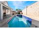 Backyard in-ground pool featuring a spa and hardscaped patio at 4411 Elk Point Cir, Las Vegas, NV 89147