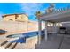 Backyard pool and spa with pergola covered patio and block wall surround at 4411 Elk Point Cir, Las Vegas, NV 89147