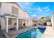 View of the pool, backyard patio, and the back of the home at 4411 Elk Point Cir, Las Vegas, NV 89147