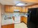 Kitchen features stainless steel appliances, granite countertops, and light wood cabinetry at 4791 E Craig Rd, Las Vegas, NV 89115