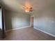 Bedroom features tile floors, ceiling fan, and offers bright, neutral space ready for personalization at 5194 Saratoga Dr, Las Vegas, NV 89120