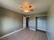 Bright bedroom features tile floors, ceiling fan, and closet, offering ample space and comfort at 5194 Saratoga Dr, Las Vegas, NV 89120