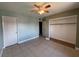 Bedroom featuring tile floors, ceiling fan, and spacious closet, offering ample storage and natural light at 5194 Saratoga Dr, Las Vegas, NV 89120