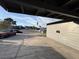 View from under the carport, showing the driveway and houses across the street at 5194 Saratoga Dr, Las Vegas, NV 89120