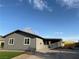 Charming single-story home features a gray exterior, covered carport, and well-maintained artificial lawn at 5194 Saratoga Dr, Las Vegas, NV 89120
