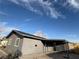 Low angle showing a gray home with a large carport with a partial view of the fencing and backyard at 5194 Saratoga Dr, Las Vegas, NV 89120
