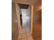 Hallway with tile flooring leading to the kitchen and living room at 5194 Saratoga Dr, Las Vegas, NV 89120