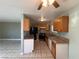 Well-lit kitchen with granite countertops, stainless steel appliances, and tile flooring that extends into the dining area at 5194 Saratoga Dr, Las Vegas, NV 89120