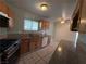 Bright kitchen featuring stainless steel appliances, wood cabinets, granite countertops, and a double basin sink at 5194 Saratoga Dr, Las Vegas, NV 89120