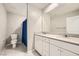 Bright bathroom with double sinks, white cabinets and large mirror at 5399 El Nevero St, Las Vegas, NV 89166