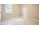 Bright bedroom with neutral paint, white trim, and a large window at 5399 El Nevero St, Las Vegas, NV 89166