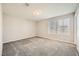 Bright bedroom featuring neutral walls, plush carpet and double windows at 5399 El Nevero St, Las Vegas, NV 89166