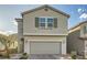 Charming two-story home featuring a two-car garage and a nicely landscaped front yard at 5399 El Nevero St, Las Vegas, NV 89166
