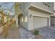Attractive two-story home featuring a two-car garage and inviting walkway to front door at 5399 El Nevero St, Las Vegas, NV 89166