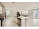 Bright, open kitchen featuring an island with bar seating and stainless steel appliances at 5399 El Nevero St, Las Vegas, NV 89166