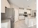 Bright kitchen featuring an island, stainless steel appliances, and ample storage space at 5399 El Nevero St, Las Vegas, NV 89166