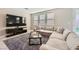 Comfortable living room featuring a large sofa and media center at 5399 El Nevero St, Las Vegas, NV 89166