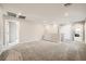 Expansive loft area with soft carpet, recessed lighting, and versatile open space at 5399 El Nevero St, Las Vegas, NV 89166
