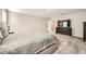 Comfortable main bedroom featuring soft carpet, dark wood furniture, and generous lighting at 5399 El Nevero St, Las Vegas, NV 89166
