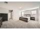 Spacious main bedroom with plush carpet, neutral colors, and plenty of natural light at 5399 El Nevero St, Las Vegas, NV 89166