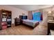 Cozy bedroom featuring plush carpet, a comfortable bed, and a window allowing natural light at 5416 Irish Spring St, Las Vegas, NV 89149