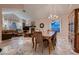 Elegant dining room featuring a chandelier, large dining table, and a view into the adjacent living area at 5416 Irish Spring St, Las Vegas, NV 89149