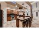 Well-lit kitchen featuring stainless steel appliances, granite countertops, and a breakfast bar with seating at 5416 Irish Spring St, Las Vegas, NV 89149