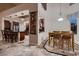 Open concept kitchen with adjacent dining area, showcasing a breakfast bar, and ample natural light at 5416 Irish Spring St, Las Vegas, NV 89149