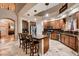 Open kitchen design with granite countertops, stainless steel appliances, ample cabinetry, and seating at the island at 5416 Irish Spring St, Las Vegas, NV 89149