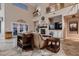 Spacious living room with a fireplace, neutral decor, and large windows, offering comfortable seating and natural light at 5416 Irish Spring St, Las Vegas, NV 89149