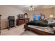 Comfortable main bedroom with soft carpet, classic furniture, and access to outdoor views at 5416 Irish Spring St, Las Vegas, NV 89149