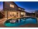 Inviting backyard pool and spa with covered patio offer a perfect outdoor entertaining space at 5416 Irish Spring St, Las Vegas, NV 89149