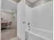 Clean bathroom with a white tiled shower, and a view into a cozy adjacent study area at 56 Lomita Heights Dr, Las Vegas, NV 89138