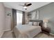 Serene bedroom features soft gray tones, ceiling fan, and coordinated decor for a relaxing atmosphere at 56 Lomita Heights Dr, Las Vegas, NV 89138