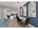 Stylish dining area with modern chandelier and accent wall, open to the kitchen at 56 Lomita Heights Dr, Las Vegas, NV 89138