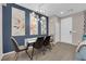 Bright dining room features contemporary lighting, stylish chairs, and complementary wall art at 56 Lomita Heights Dr, Las Vegas, NV 89138